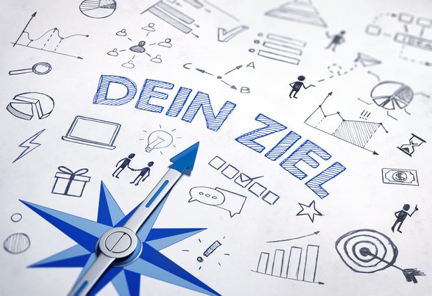 Grafik eines Kompasses, der auf einen Schriftzug zeigt. Der Schriftzug lautet: Dein Ziel. 